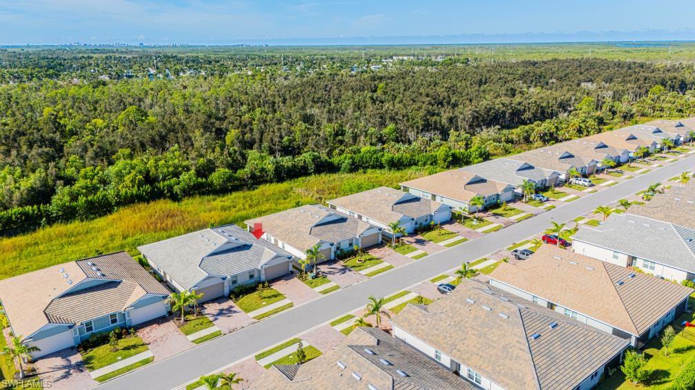 1050 Enbrook Loop Naples, FL 34114 - Photo 29 of 29 an aerial view of a city