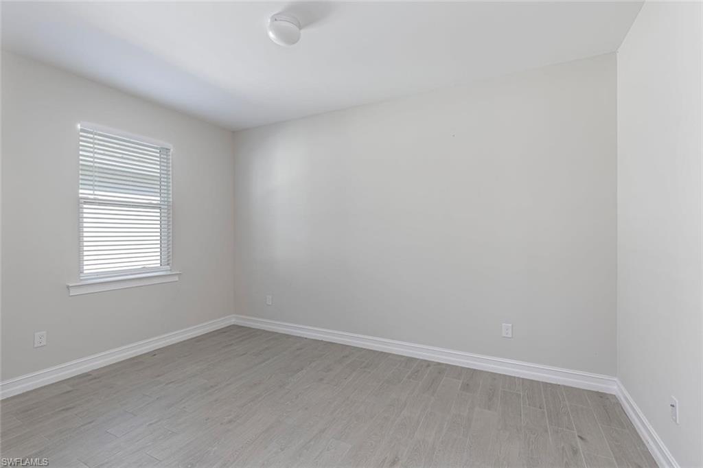 1050 Enbrook Loop Naples, FL 34114 - Photo 5 of 29 an empty room with a window
