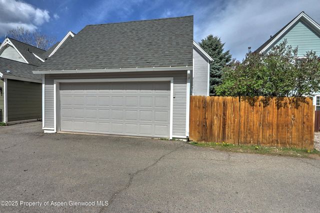 a view of front door and yard