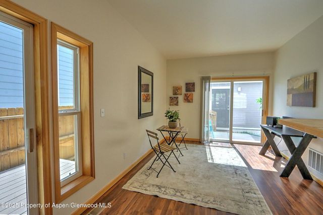 a view of a livingroom with furniture and a window