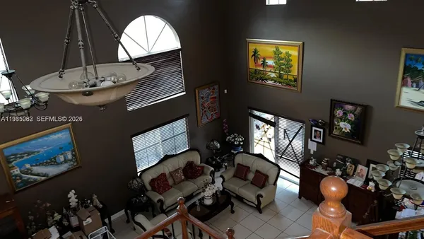 a living room with furniture a fireplace and decor