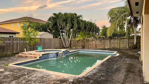 a view of a swimming pool with a patio