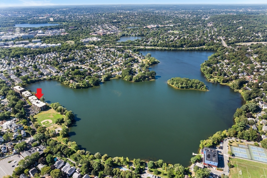 34 Hamilton Road, Unit 302 Arlington, MA 02474 - Photo 28 of 30 an aerial view of lake and residential houses with outdoor space