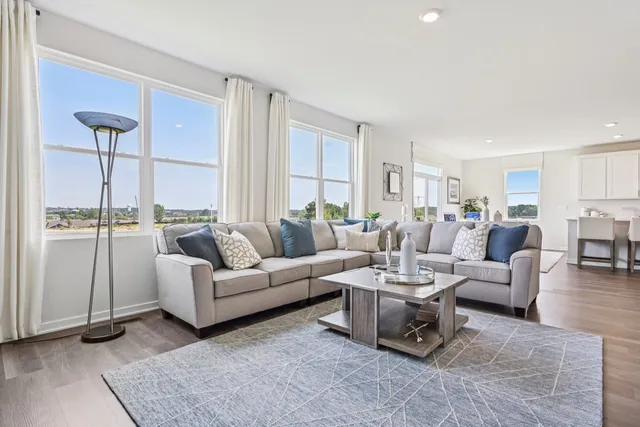 a living room with furniture and a table