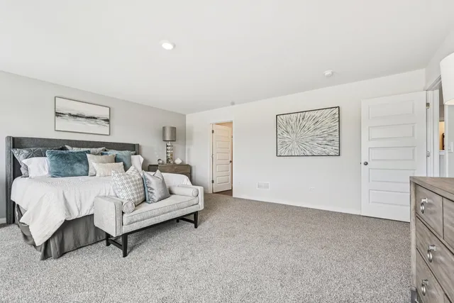 a bed room with furniture and a wall painting