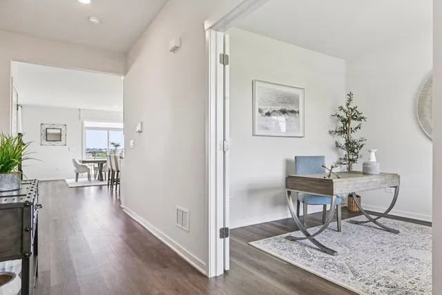 a view of a livingroom with furniture and wooden floor