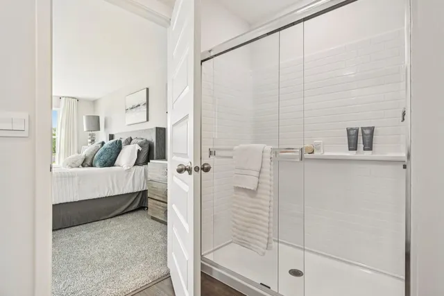 a bathroom with a tub and shower