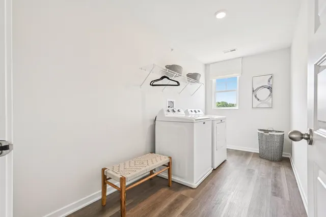 a spacious bedroom with a bed and window