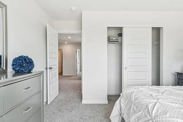 a bed room with a bed and a window