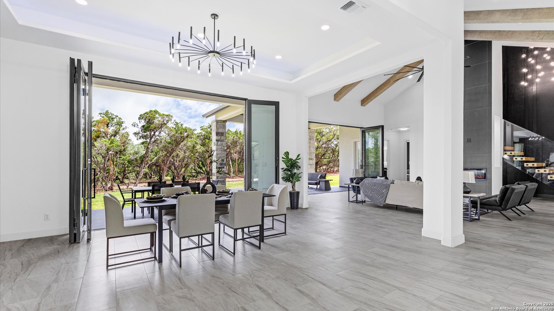 22327 Scenic Loop Road San Antonio, TX 78255 - Photo 11 of 59 a view of a dining room with furniture window and wooden floor