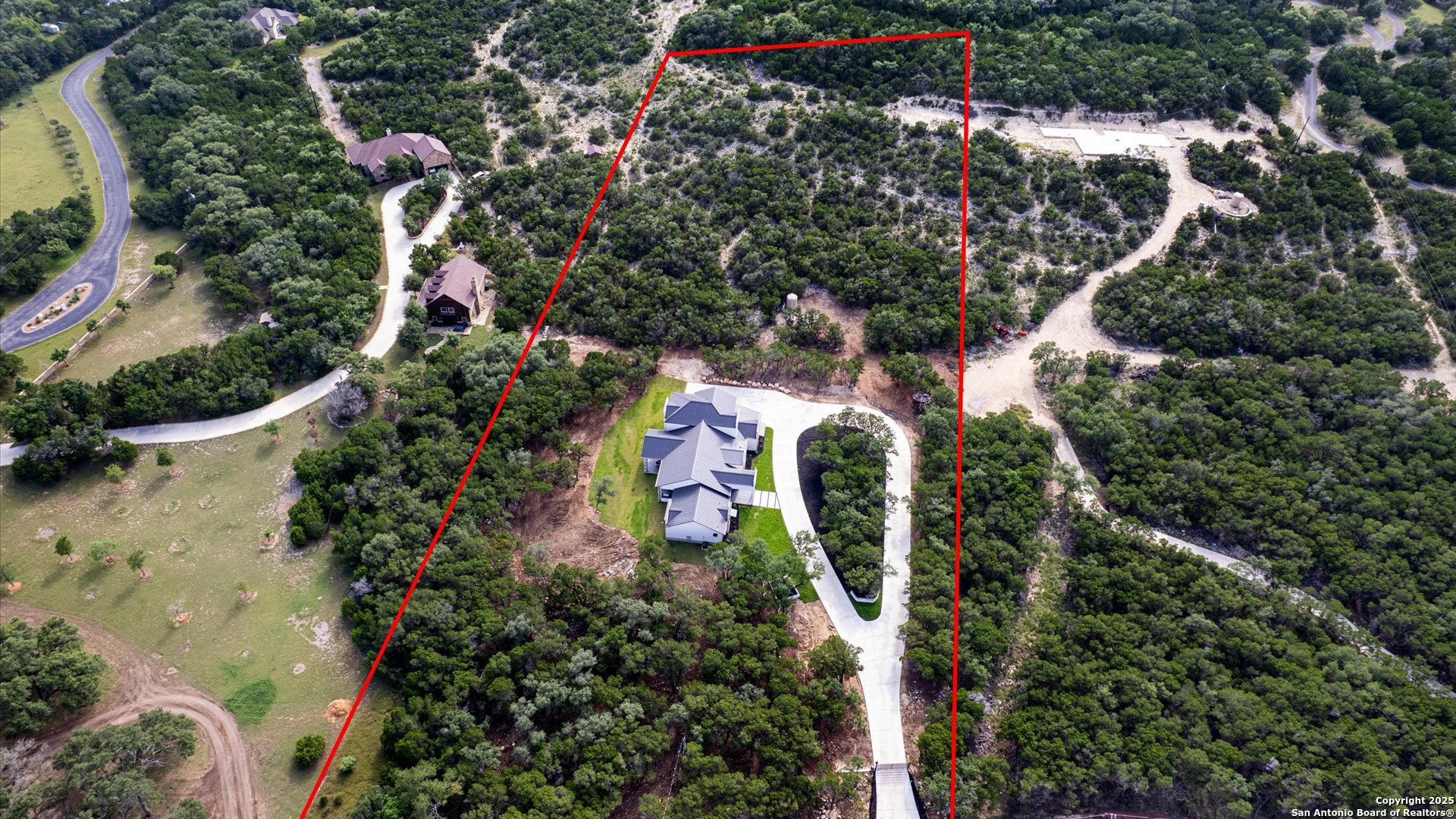 22327 Scenic Loop Road San Antonio, TX 78255 - Photo 13 of 59 an aerial view of residential house with outdoor space and trees all around