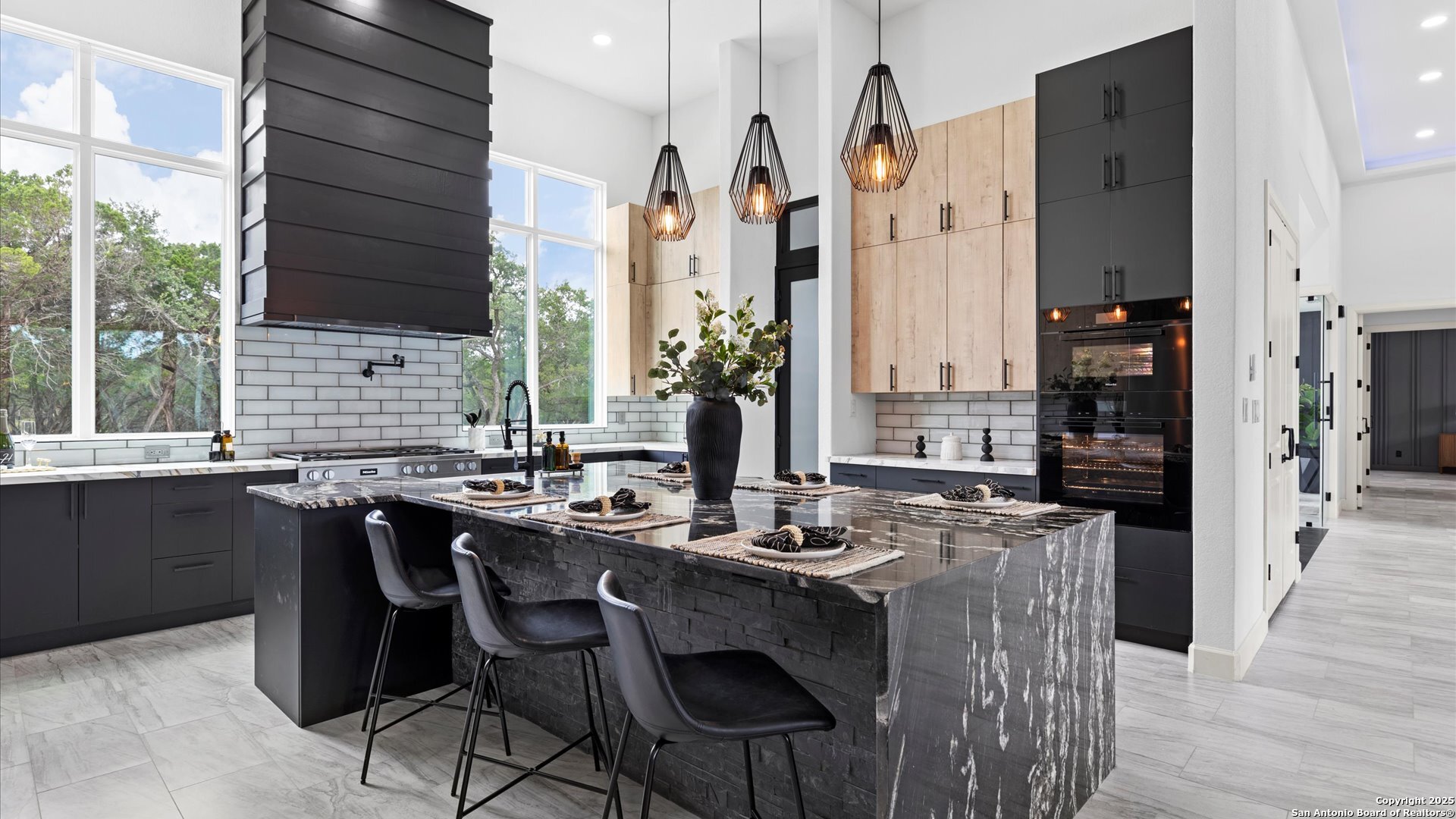 22327 Scenic Loop Road San Antonio, TX 78255 - Photo 18 of 59 a dining table with chairs and window