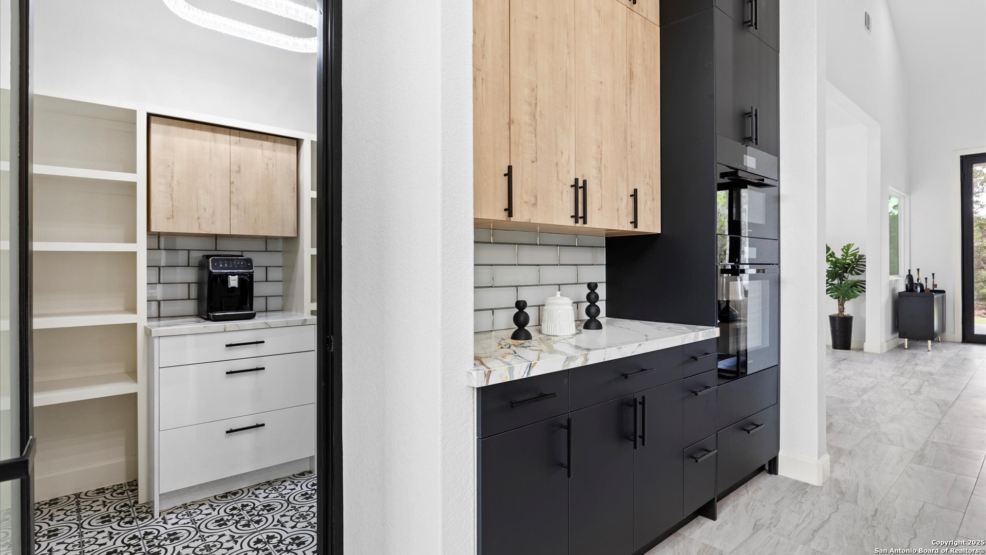 22327 Scenic Loop Road San Antonio, TX 78255 - Photo 19 of 59 a view of a bathroom with a sink and mirror