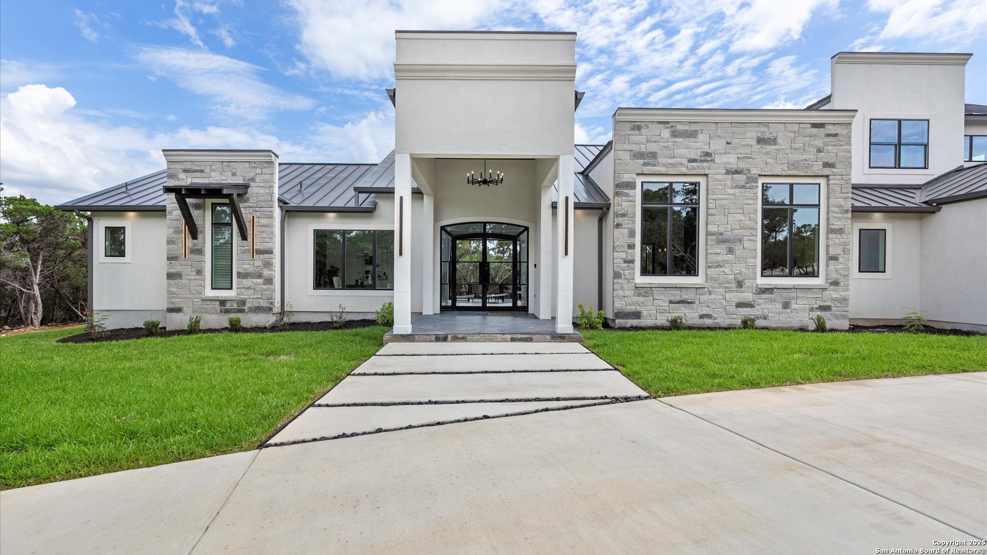 22327 Scenic Loop Road San Antonio, TX 78255 - Photo 21 of 59 front view of a house with a yard