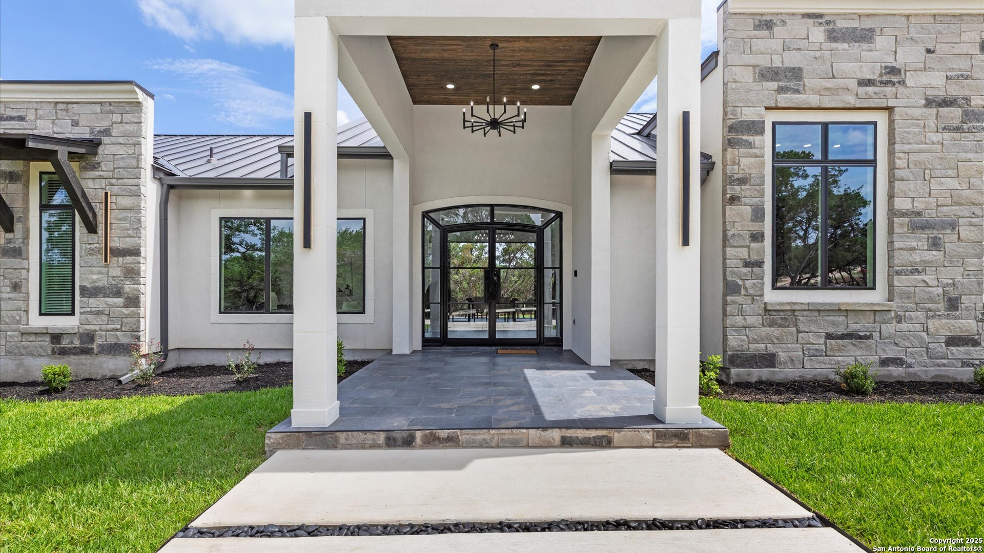 22327 Scenic Loop Road San Antonio, TX 78255 - Photo 23 of 59 front view of a house with a yard