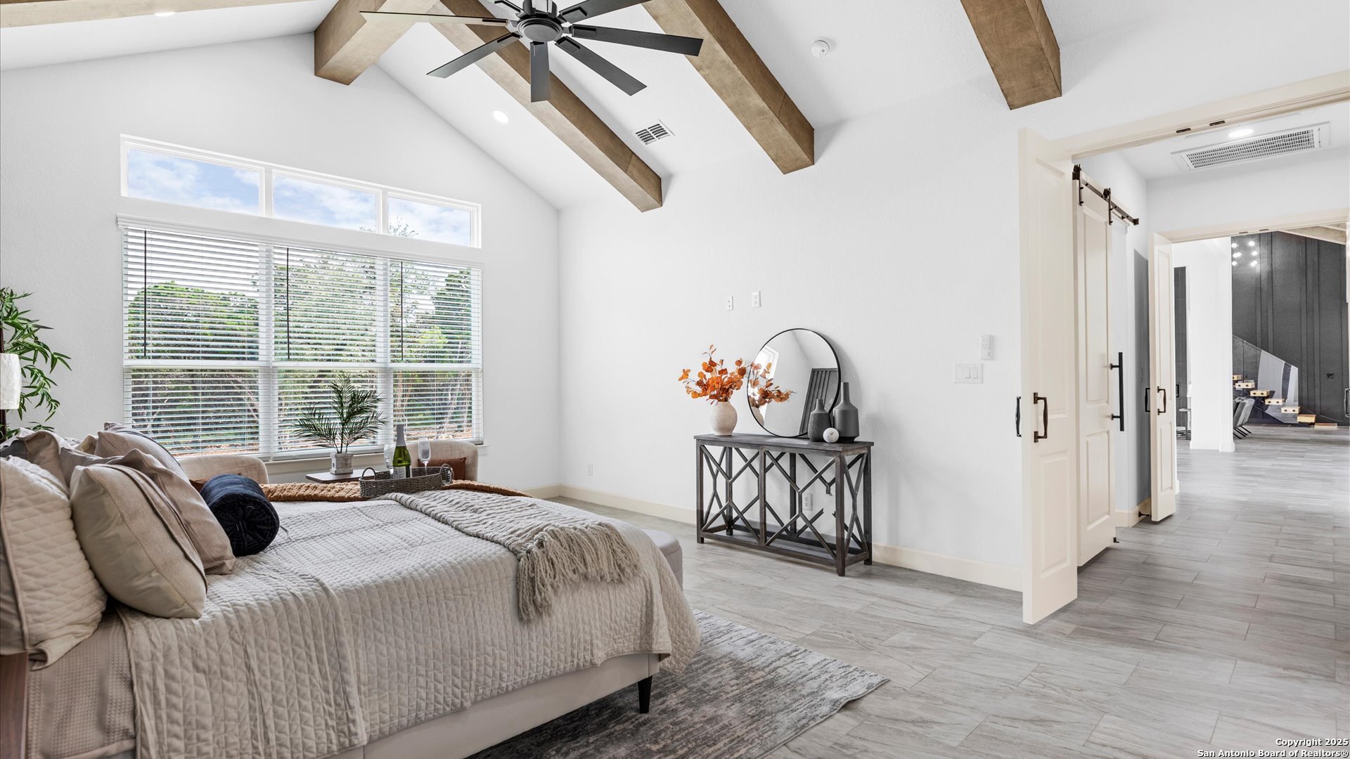 22327 Scenic Loop Road San Antonio, TX 78255 - Photo 26 of 59 a bedroom with furniture and a window