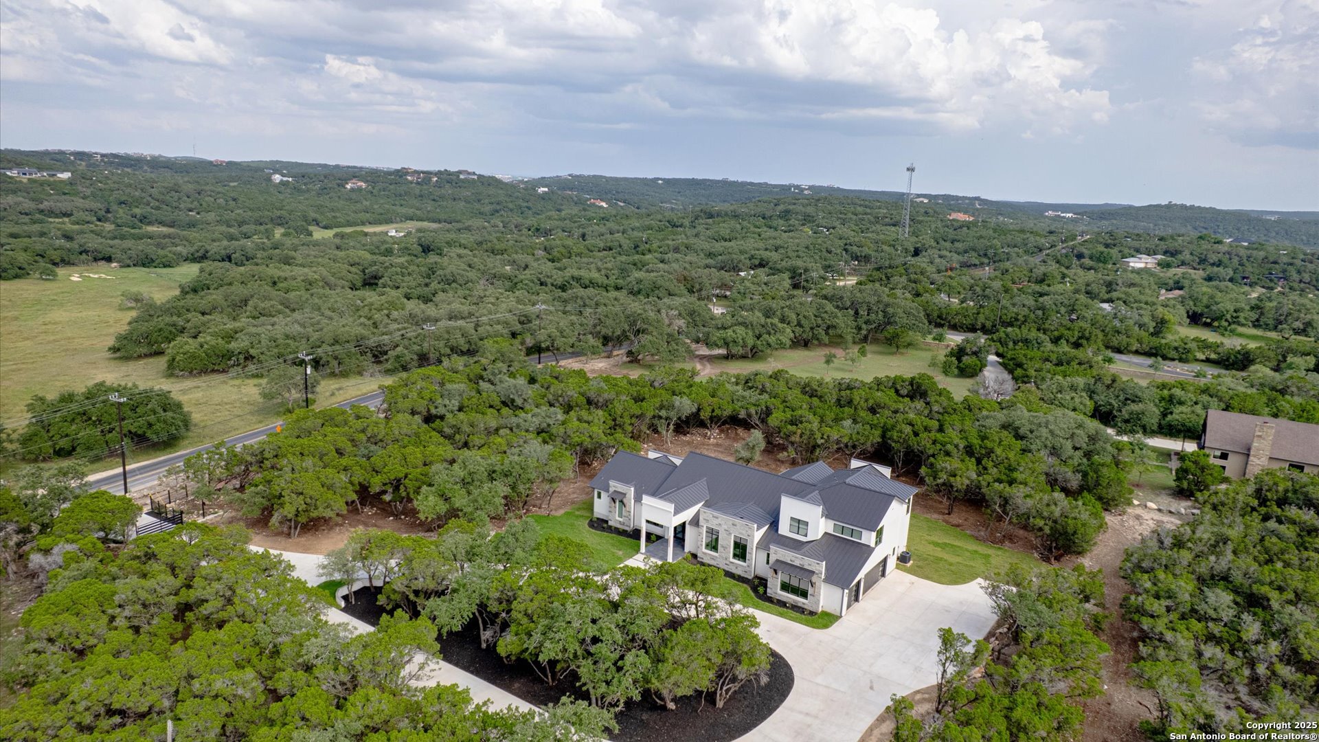 22327 Scenic Loop Road San Antonio, TX 78255 - Photo 3 of 59 an aerial view of a city with lots of residential buildings