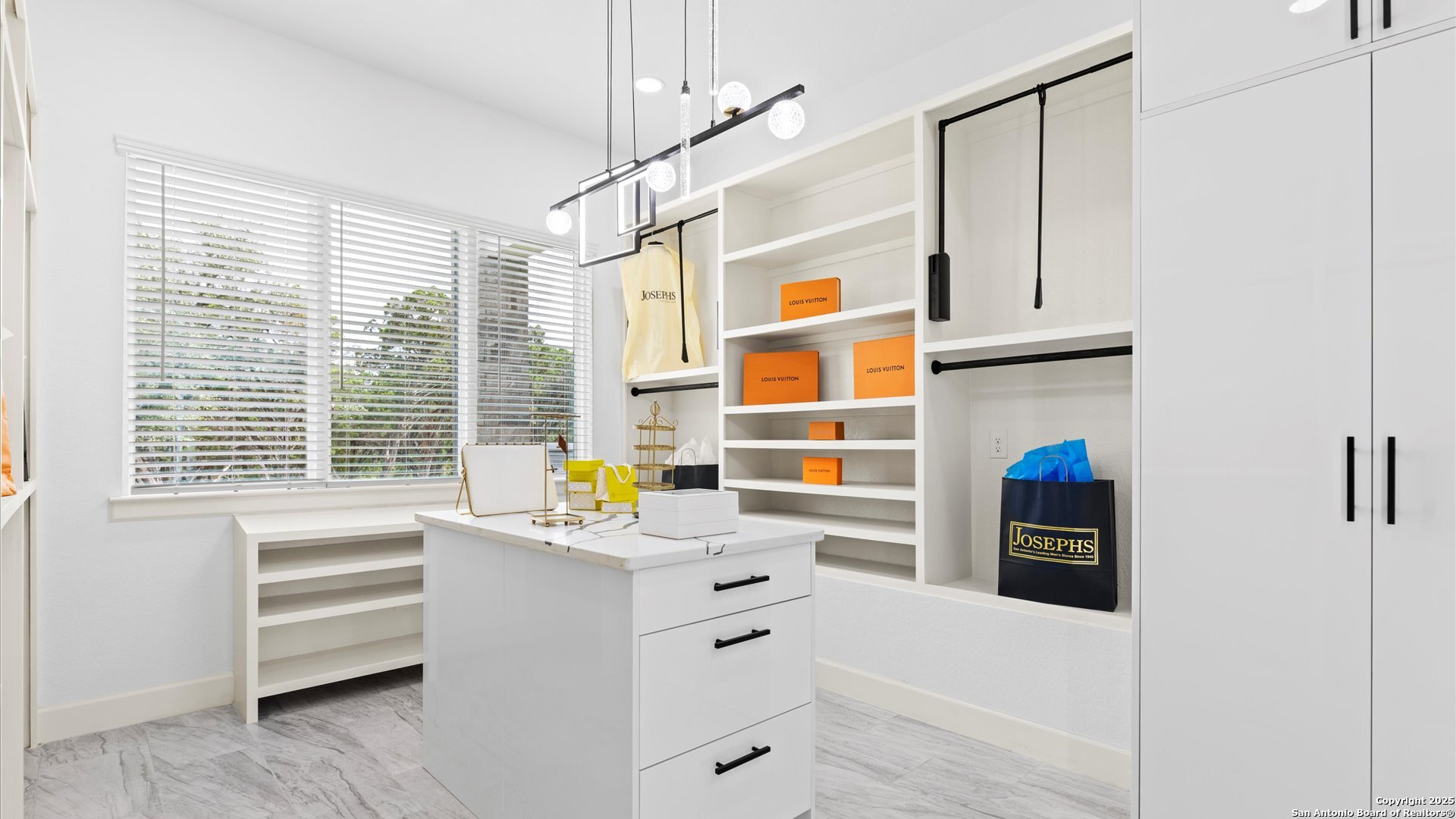 22327 Scenic Loop Road San Antonio, TX 78255 - Photo 32 of 59 a kitchen that has a sink a window and stainless steel appliances