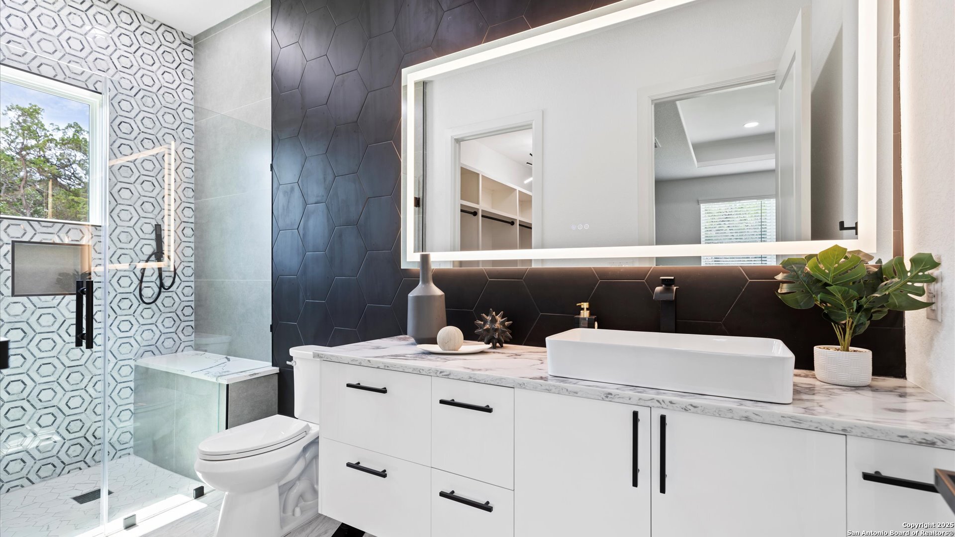 22327 Scenic Loop Road San Antonio, TX 78255 - Photo 37 of 59 a bathroom with a granite countertop toilet sink and mirror