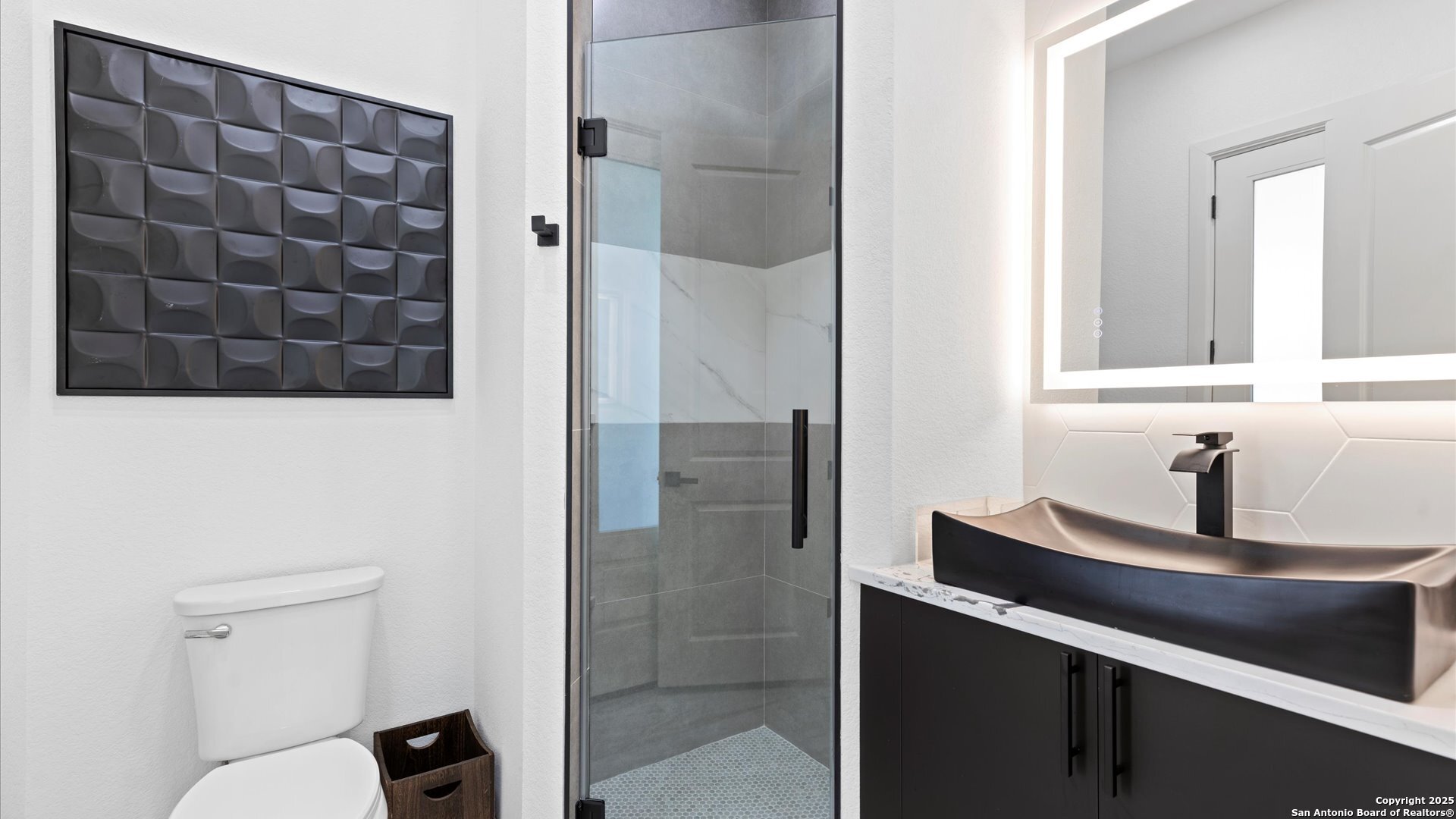 22327 Scenic Loop Road San Antonio, TX 78255 - Photo 39 of 59 a bathroom with a sink and a mirror