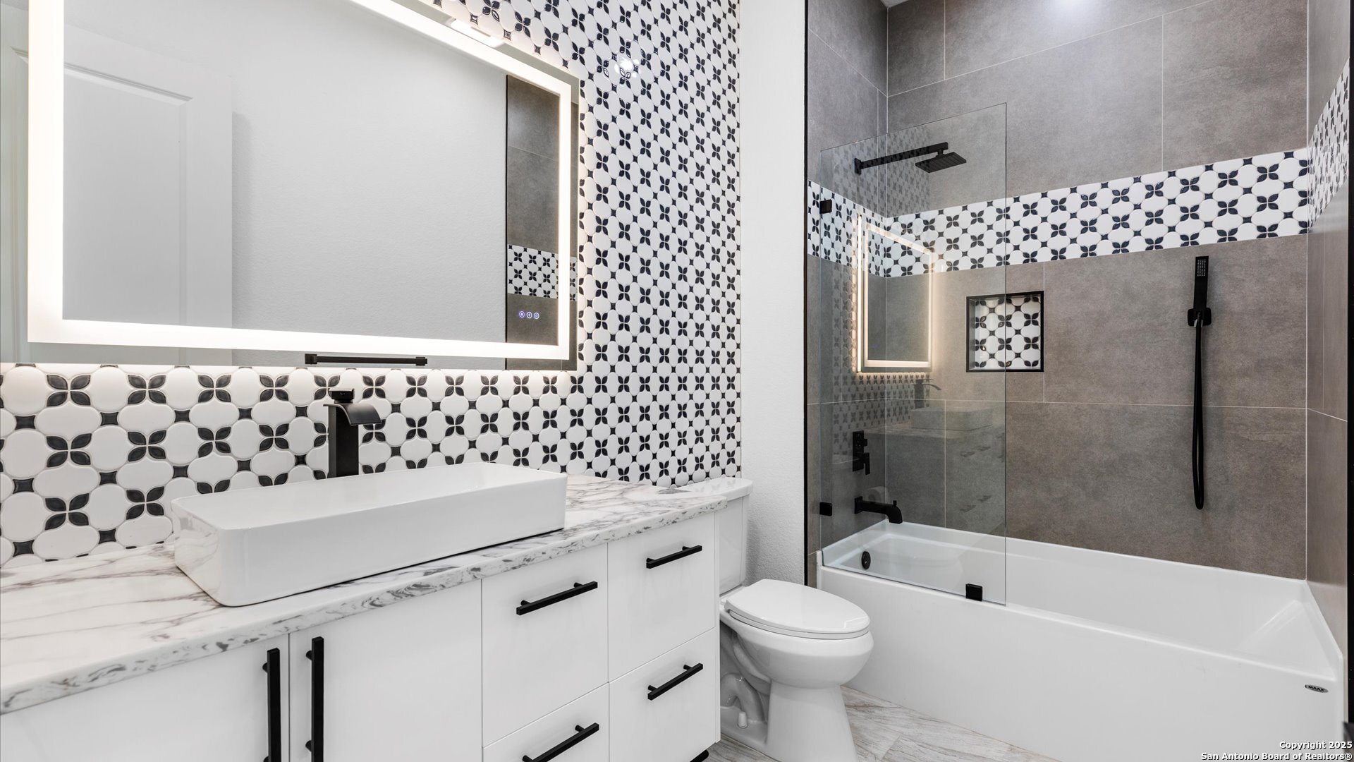 22327 Scenic Loop Road San Antonio, TX 78255 - Photo 47 of 59 a bathroom with a sink toilet and shower