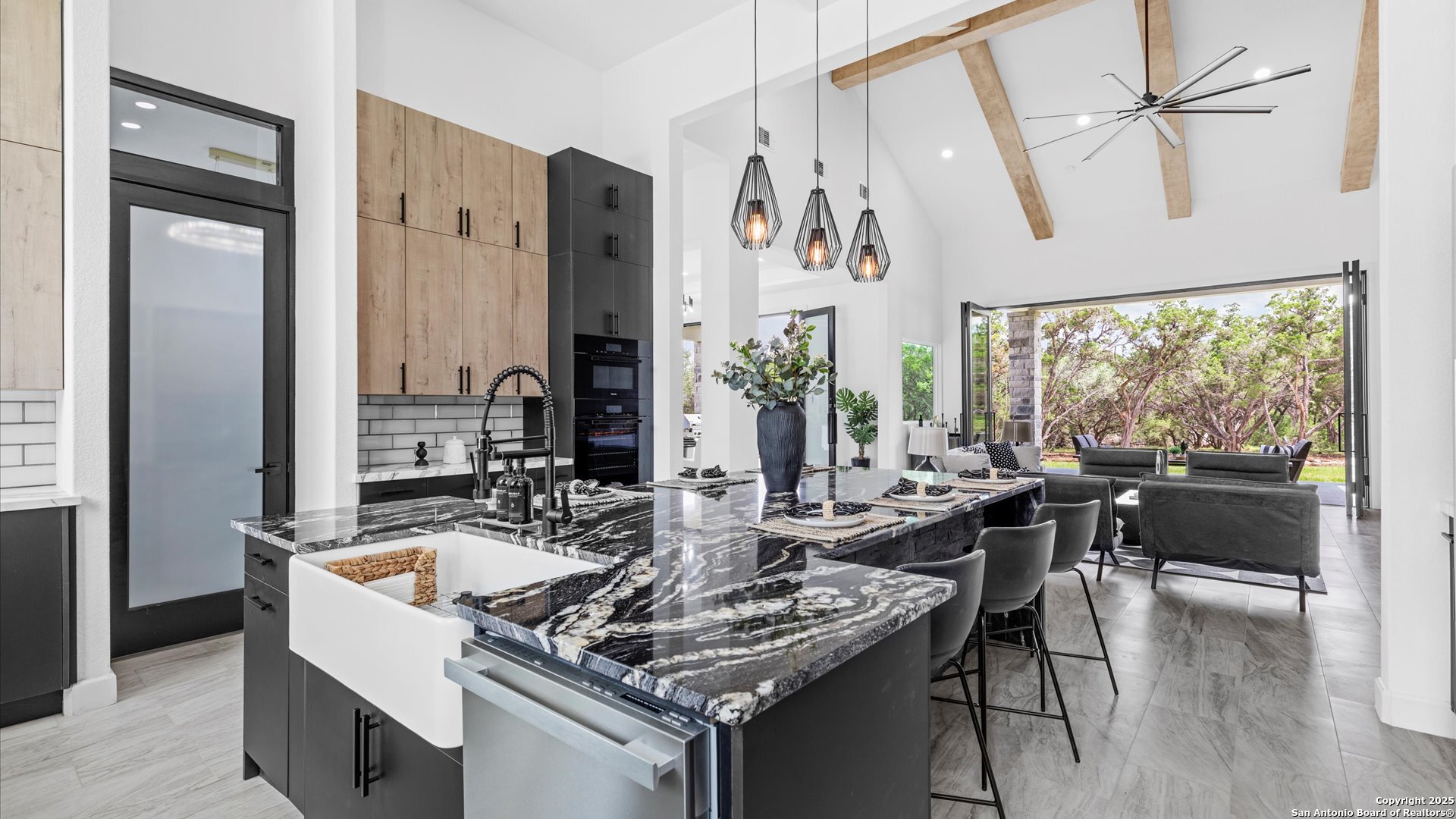 22327 Scenic Loop Road San Antonio, TX 78255 - Photo 5 of 59 a kitchen with a table chairs stove and refrigerator