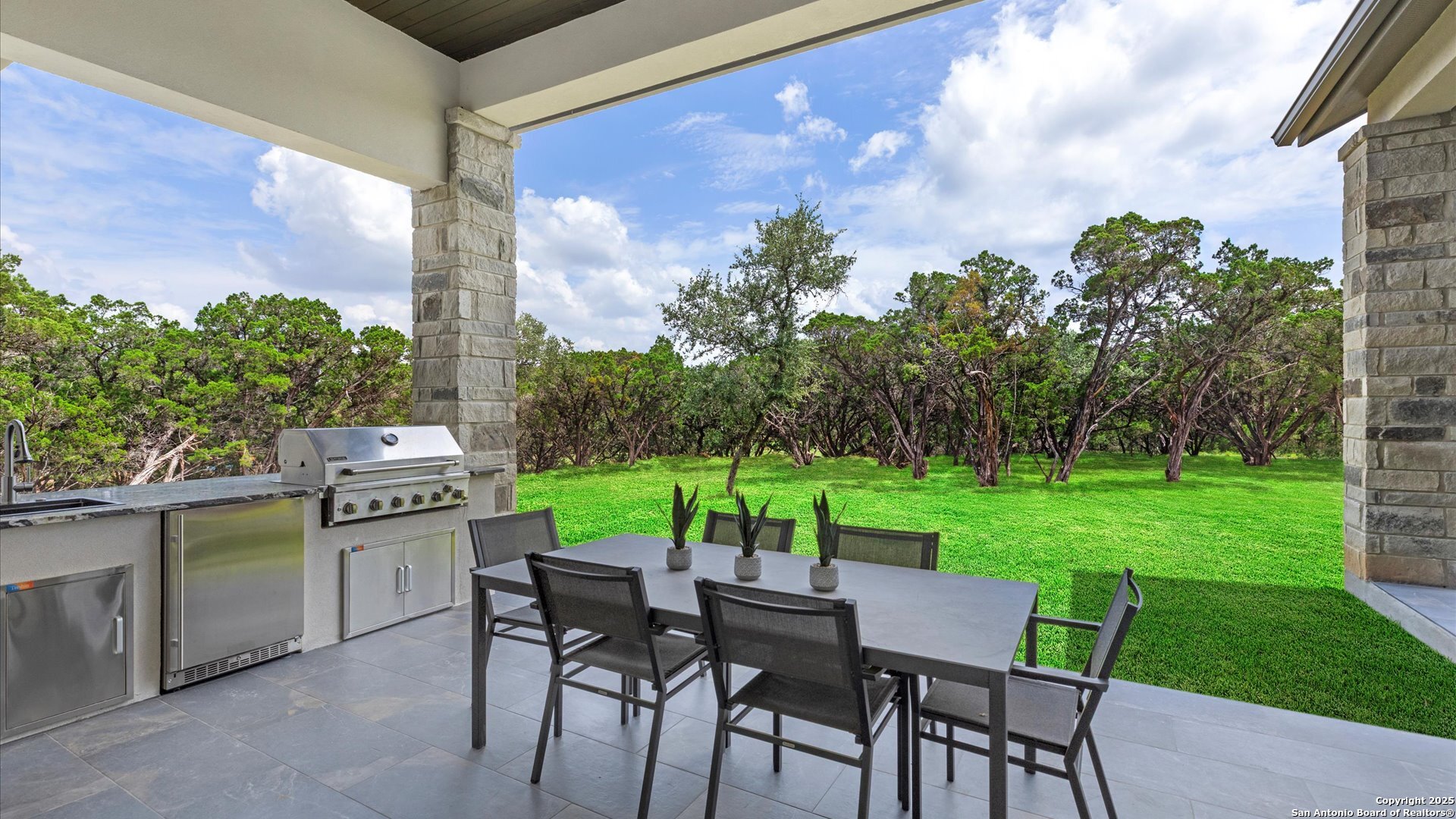 22327 Scenic Loop Road San Antonio, TX 78255 - Photo 54 of 59 a view of a chairs and table in patio next to a yard