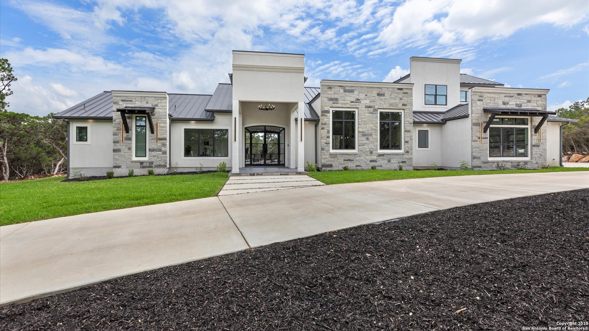 22327 Scenic Loop Road San Antonio, TX 78255 - Photo 6 of 59 a front view of building with yard
