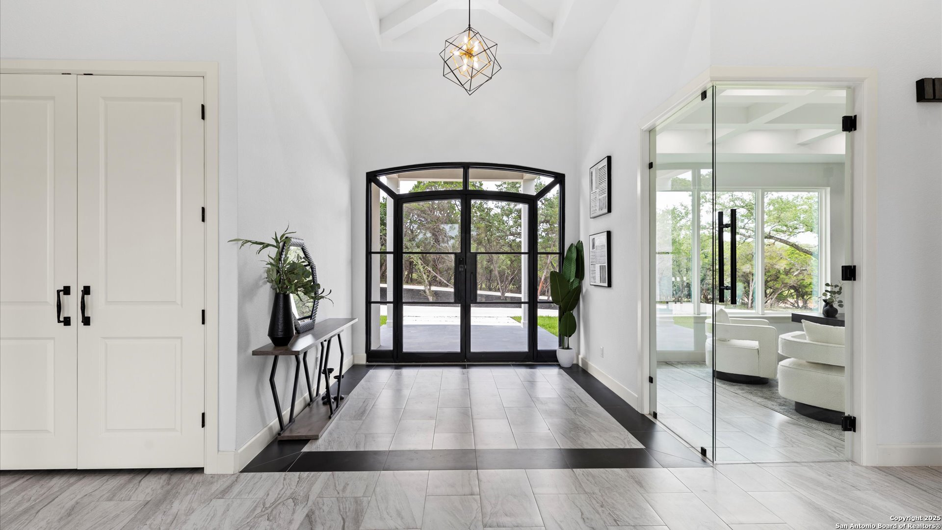 22327 Scenic Loop Road San Antonio, TX 78255 - Photo 8 of 59 a hallway with a wooden floor and a table