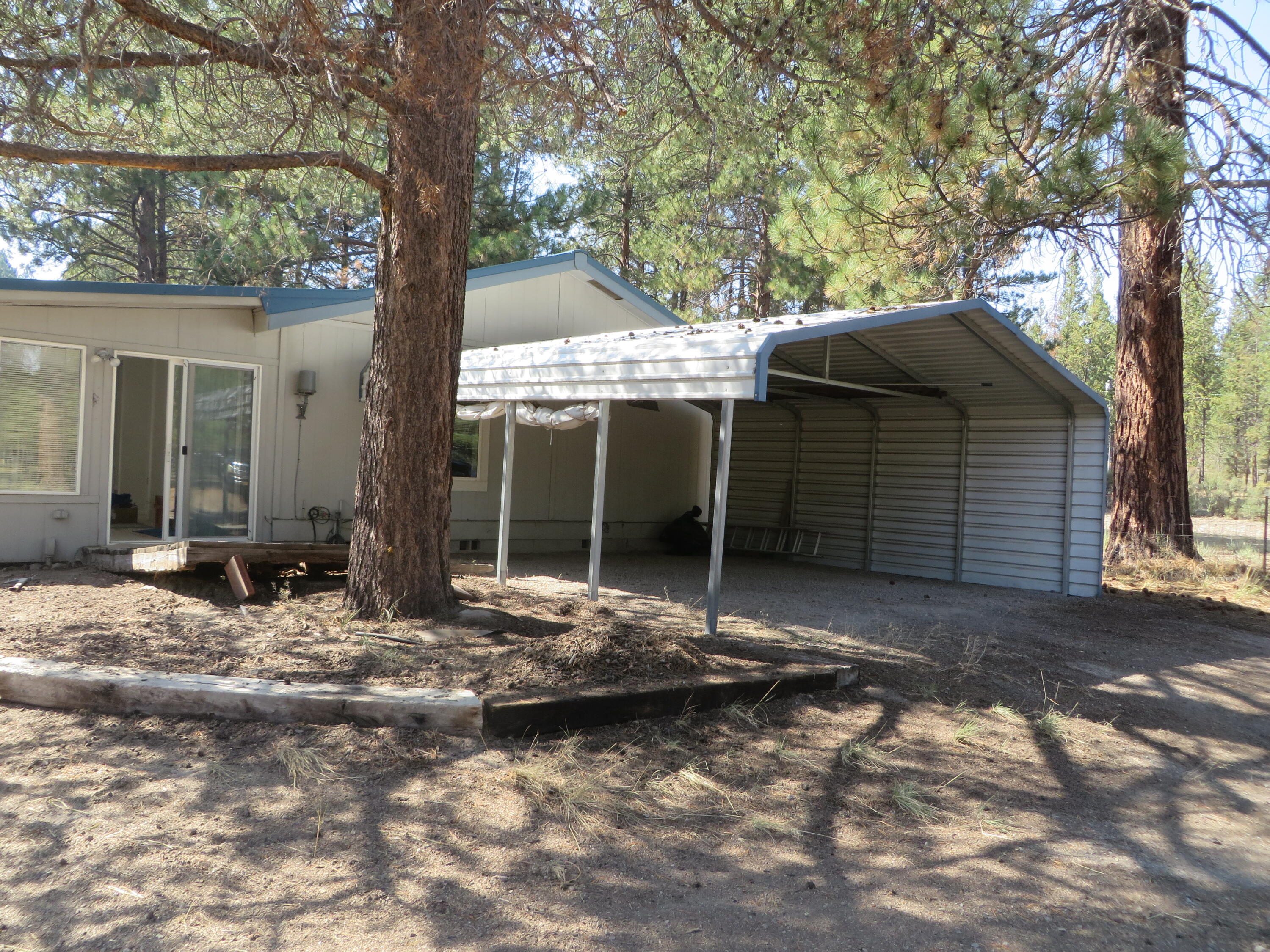 40020 9 Mile Road Chiloquin, OR 97624 - Photo 30 of 54 this is the metal carport by the front door into the breezeway-enclosed porch area