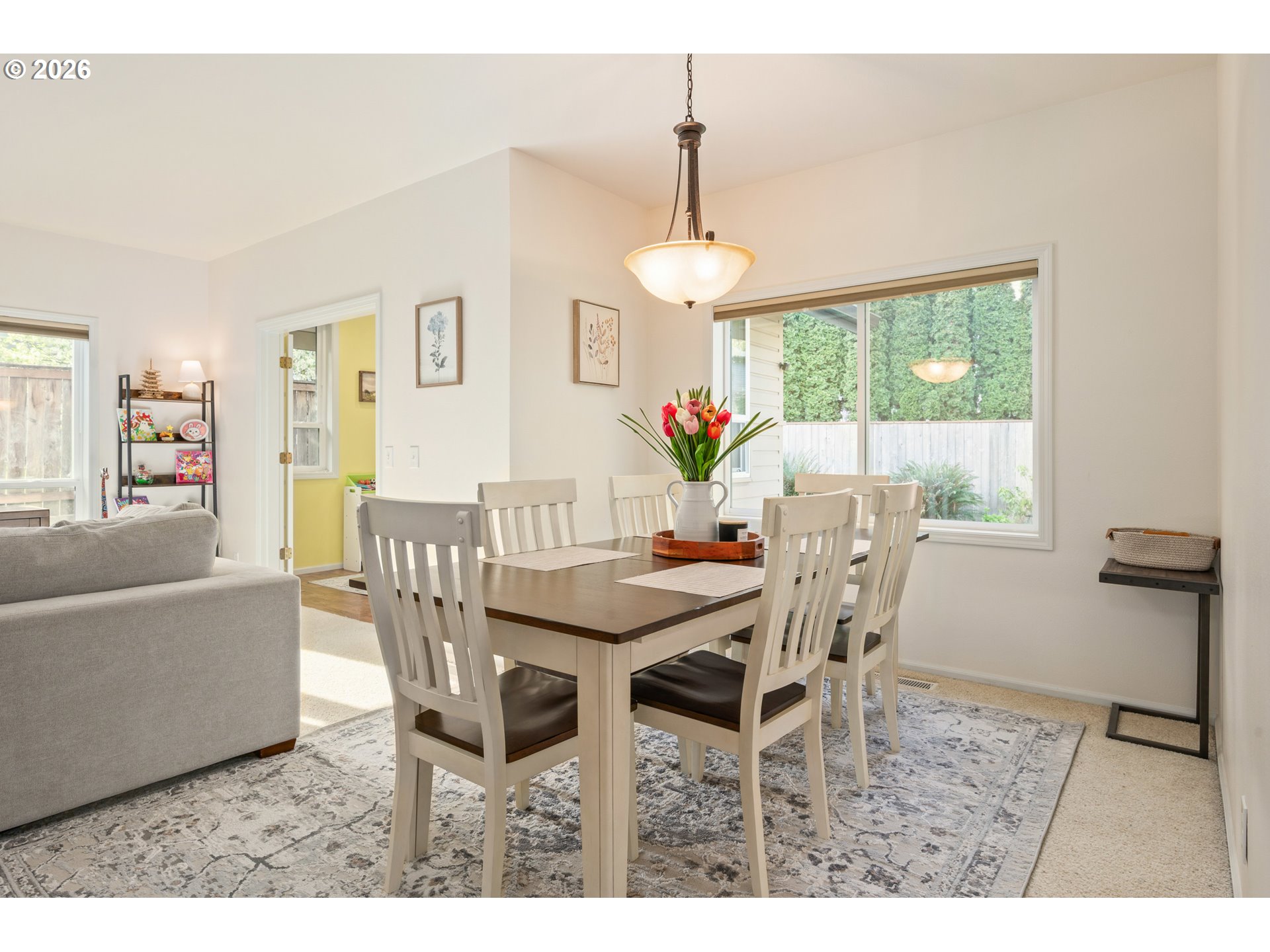 2436 Greiner Street Eugene, OR 97405 - Photo 12 of 45 a dining room with furniture a chandelier and wooden floor