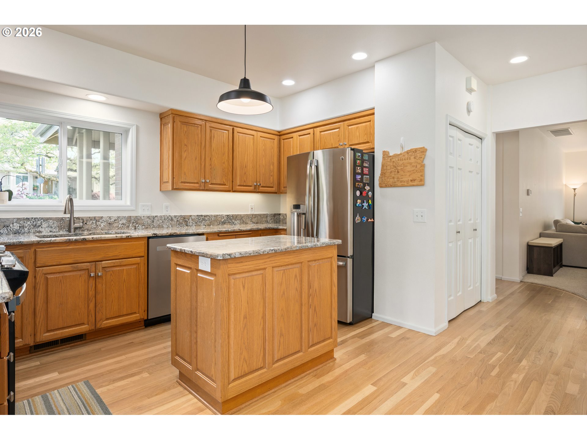 2436 Greiner Street Eugene, OR 97405 - Photo 13 of 45 a kitchen with stainless steel appliances granite countertop a refrigerator and a sink