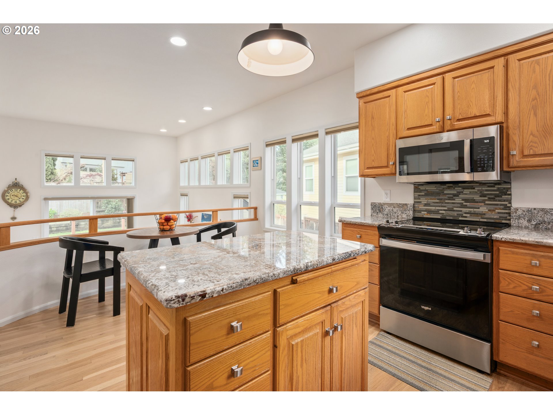 2436 Greiner Street Eugene, OR 97405 - Photo 15 of 45 a kitchen with stainless steel appliances granite countertop a stove microwave and cabinets