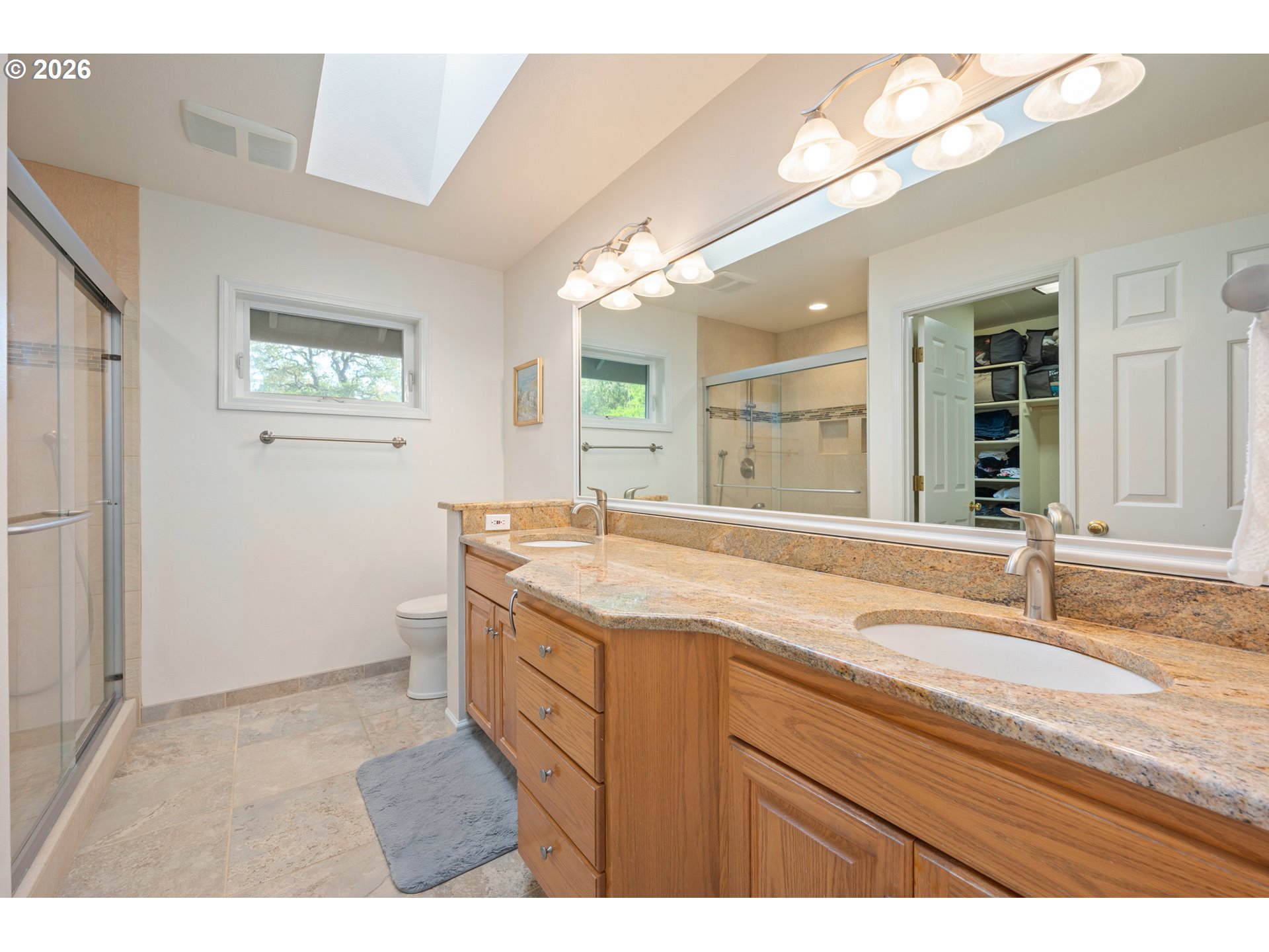 2436 Greiner Street Eugene, OR 97405 - Photo 23 of 45 a bathroom with a granite countertop sink mirror and a
