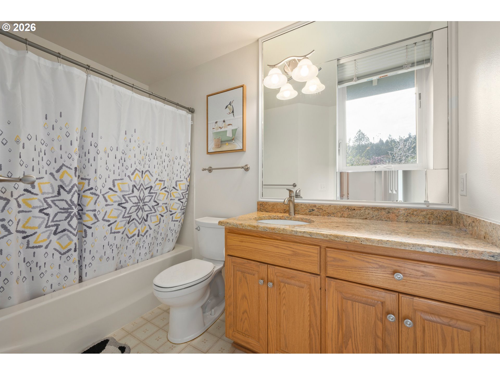 2436 Greiner Street Eugene, OR 97405 - Photo 32 of 45 a bathroom with a granite countertop sink a toilet and a window