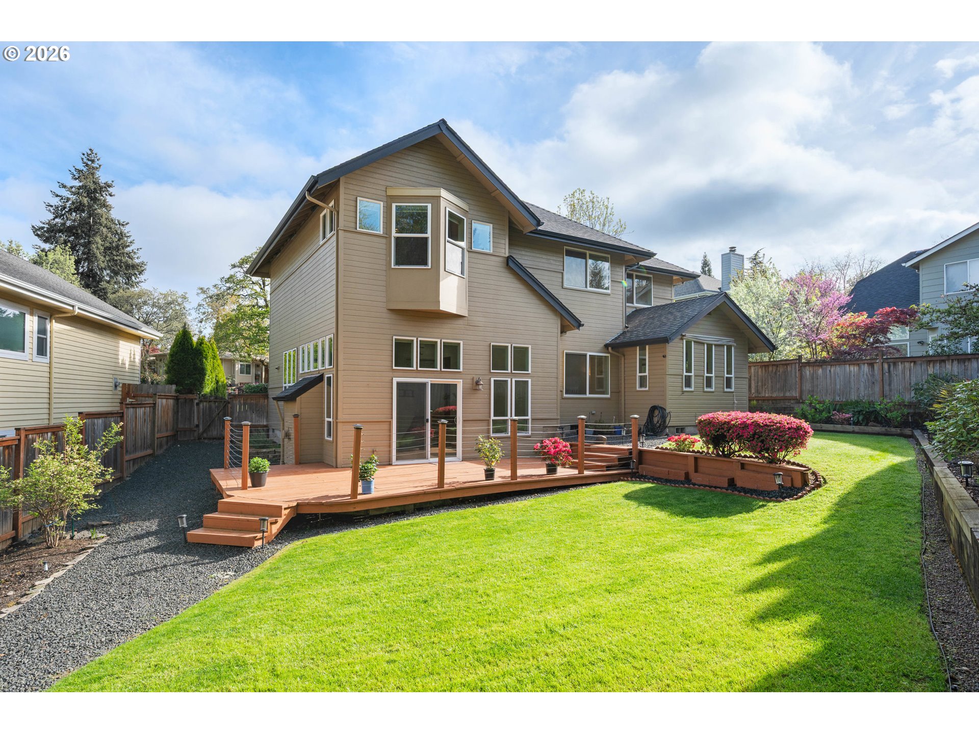 2436 Greiner Street Eugene, OR 97405 - Photo 40 of 45 a front view of a house with a garden and trees