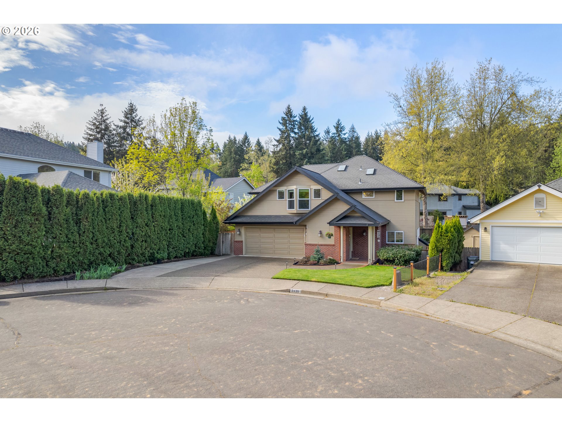 2436 Greiner Street Eugene, OR 97405 - Photo 41 of 45 a front view of a house with a garden and trees