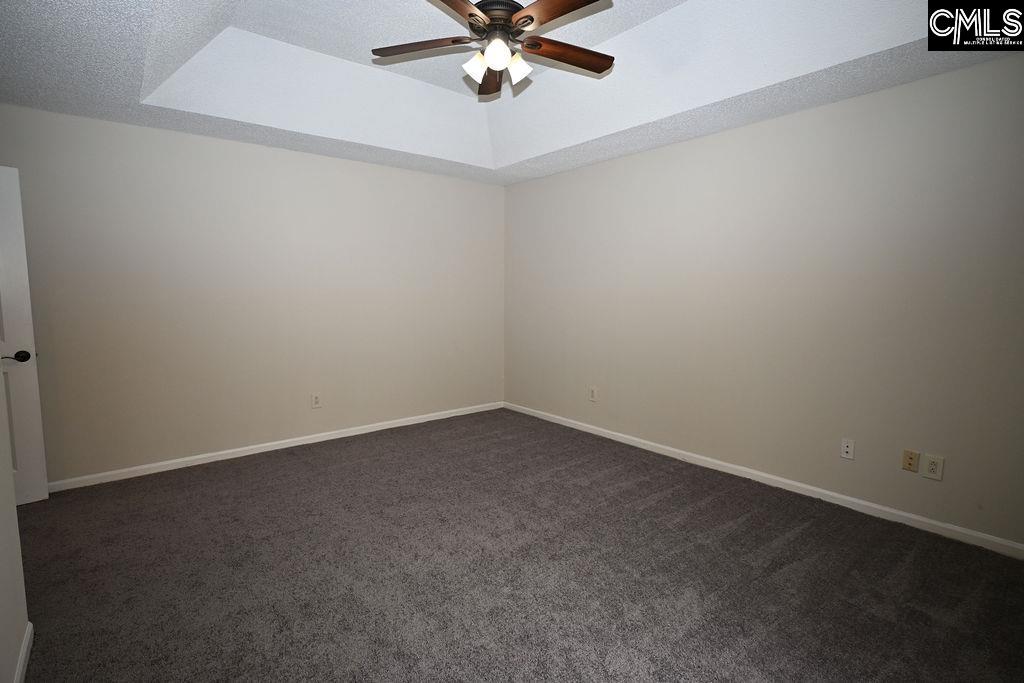 88 Running Deer Road Blythewood, SC 29016 - Photo 11 of 24 an empty room with a ceiling fan and window