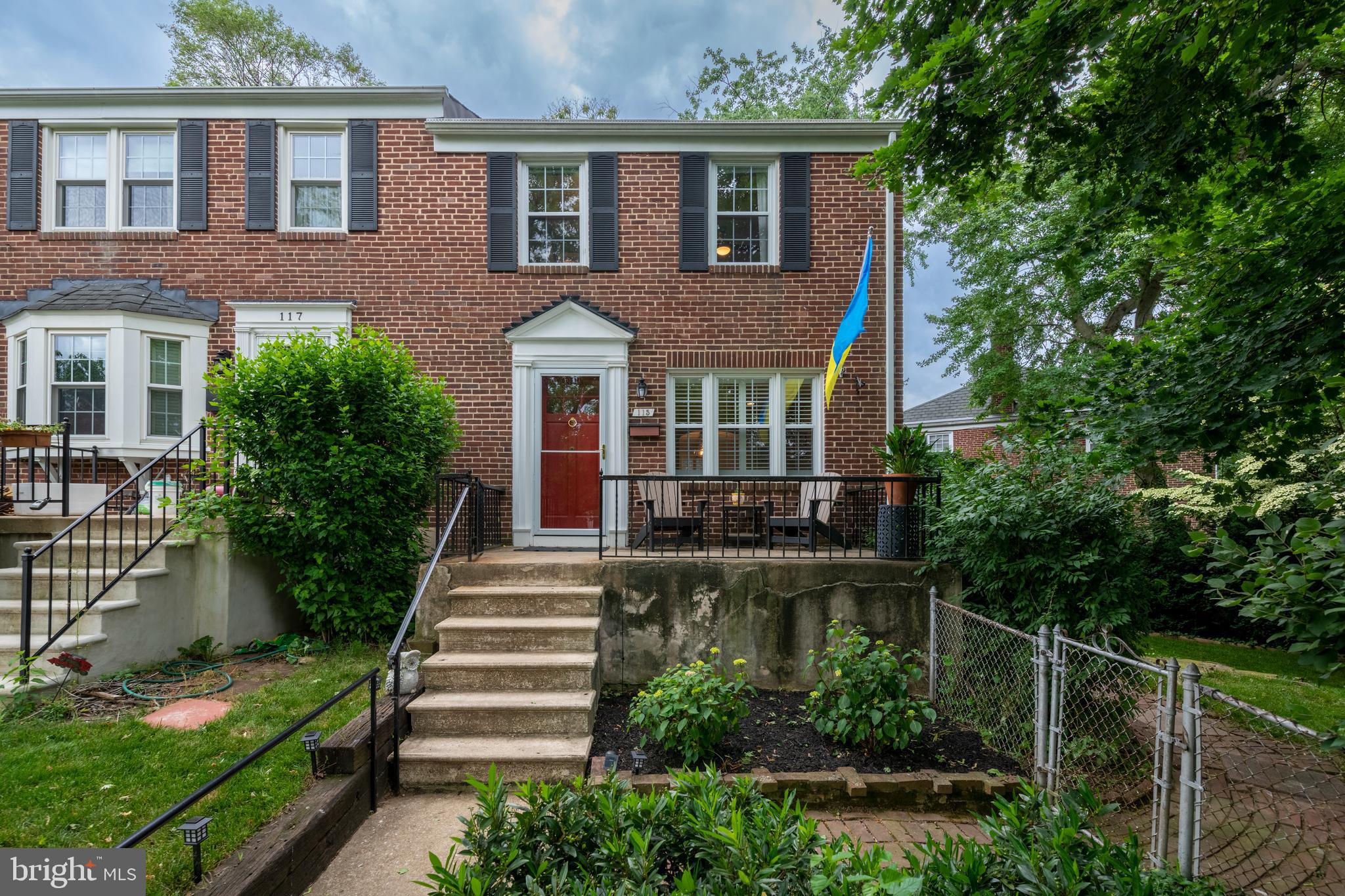 115 Brandon Road Baltimore, MD 21212 - Photo 2 of 39 a front view of a house with plants and garden
