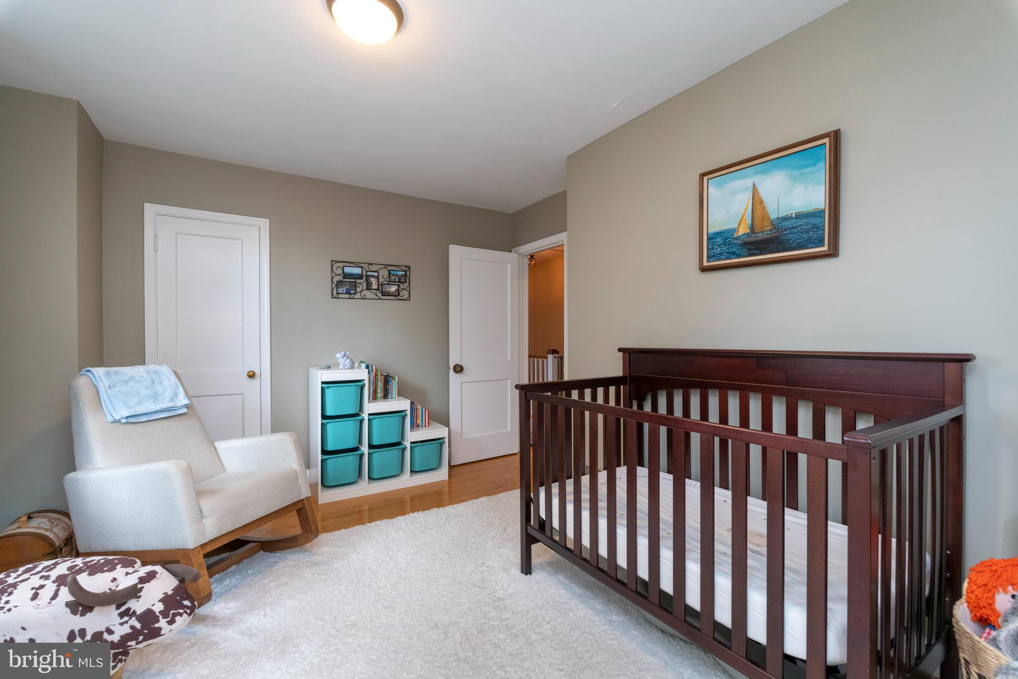 115 Brandon Road Baltimore, MD 21212 - Photo 22 of 39 a bedroom with furniture and a window