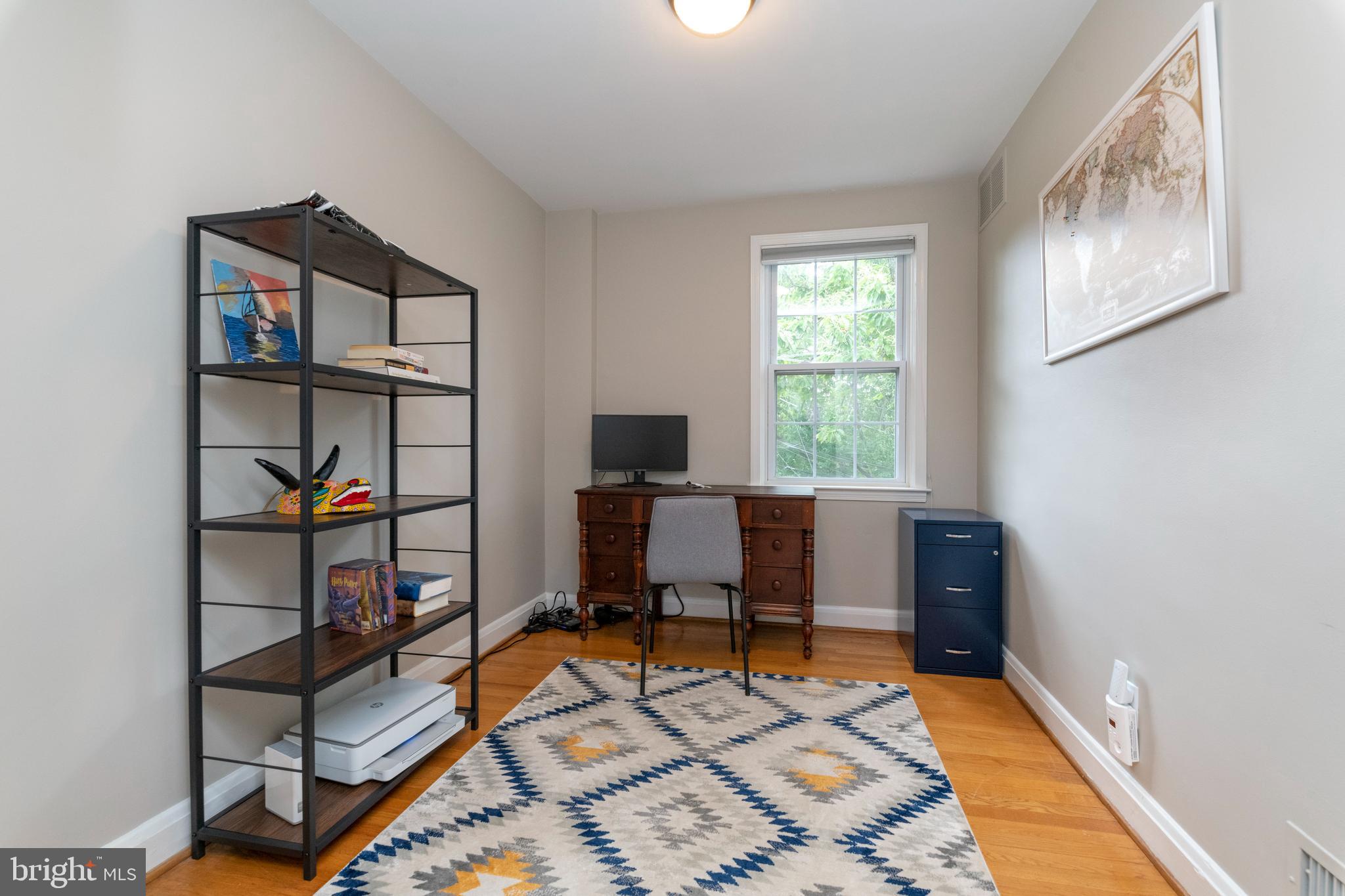 115 Brandon Road Baltimore, MD 21212 - Photo 26 of 39 a work room with furniture and a window