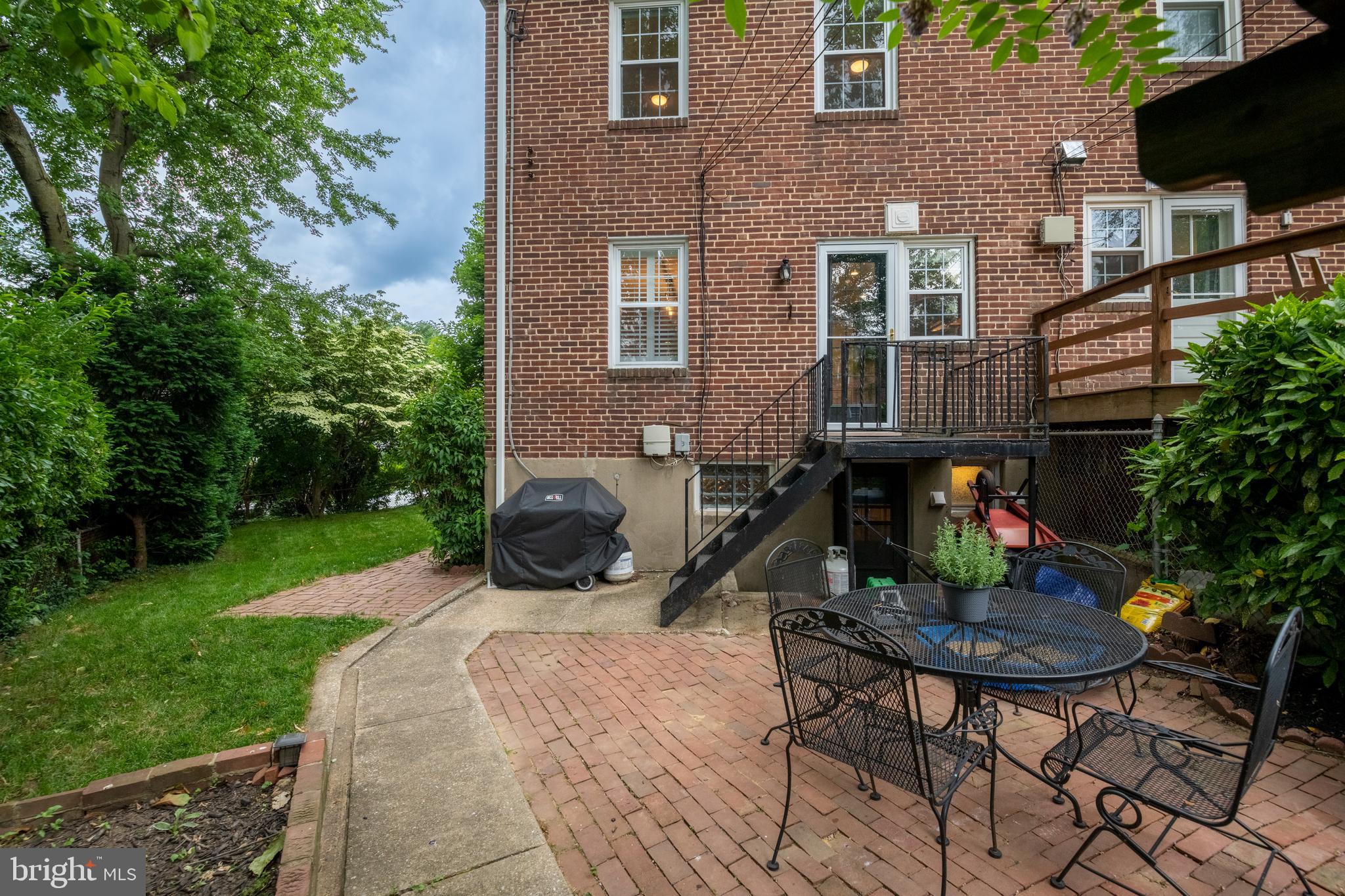 115 Brandon Road Baltimore, MD 21212 - Photo 33 of 39 a view of backyard with outdoor seating a patio and plants