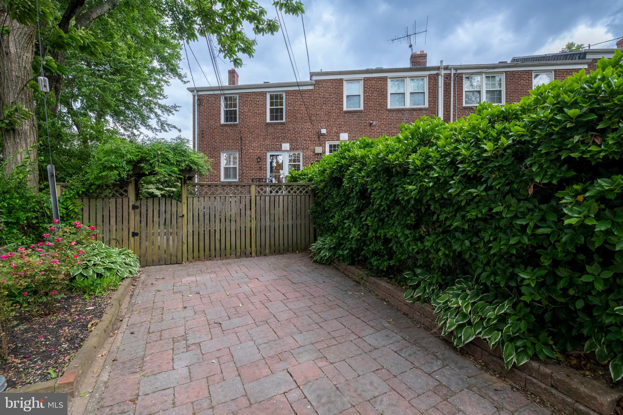 115 Brandon Road Baltimore, MD 21212 - Photo 35 of 39 a view of backyard with potted plants and wooden fence