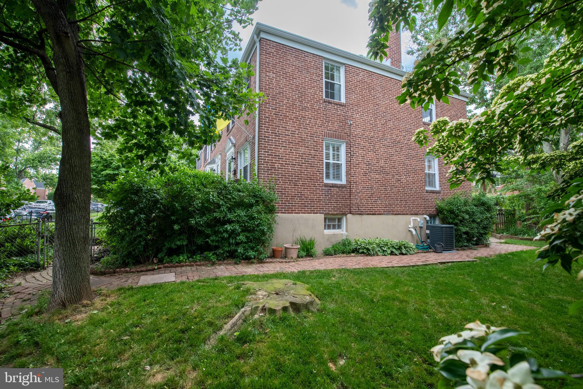 115 Brandon Road Baltimore, MD 21212 - Photo 37 of 39 a view of a house with a yard and a garden