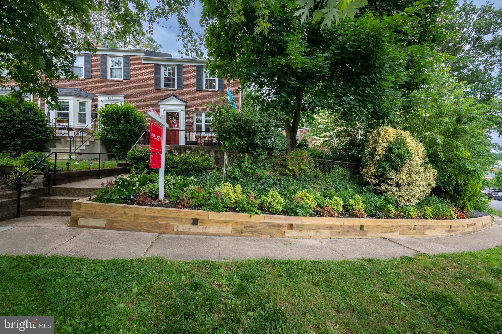 115 Brandon Road Baltimore, MD 21212 - Photo 38 of 39 a front view of a house with a yard and tree s