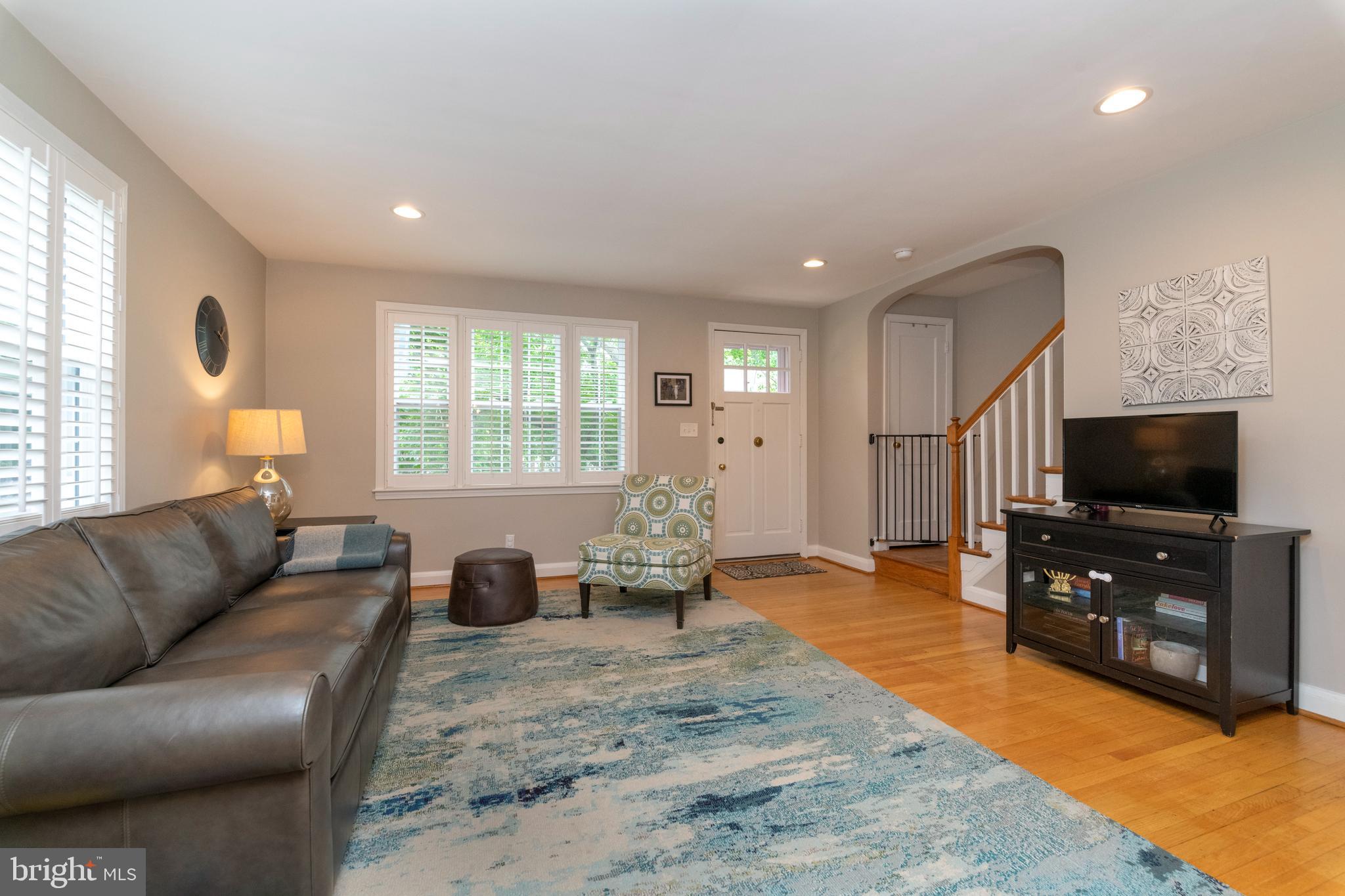 115 Brandon Road Baltimore, MD 21212 - Photo 4 of 39 a living room with furniture and a flat screen tv