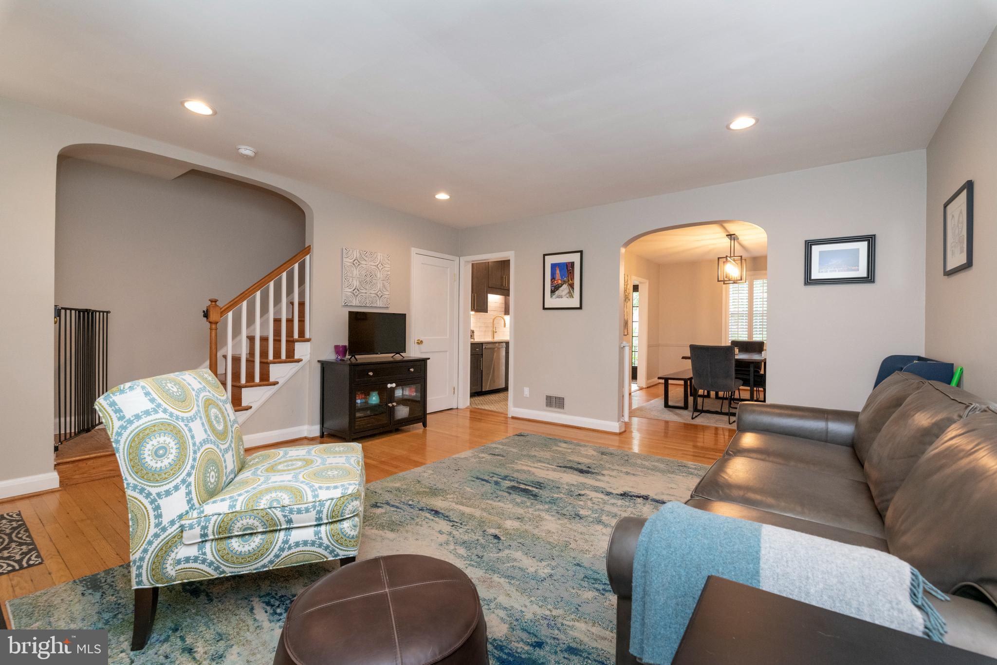 115 Brandon Road Baltimore, MD 21212 - Photo 6 of 39 a living room with furniture and a wooden floor