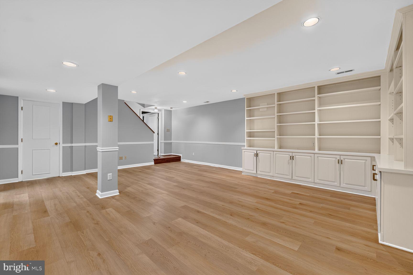 10 Treworthy Road Gaithersburg, MD 20878 - Photo 22 of 30 Lower Level Living Area w/ Built-ins