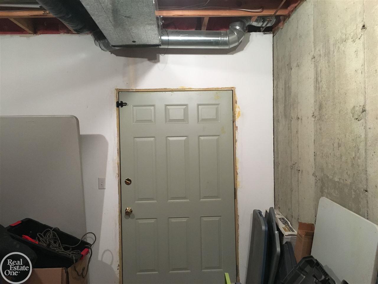 4213 Hosner Road Metamora, MI 48455 - Photo 43 of 57 Oversized service door to basement utility area.