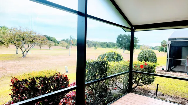 a view of a balcony with wooden floor and outdoor space